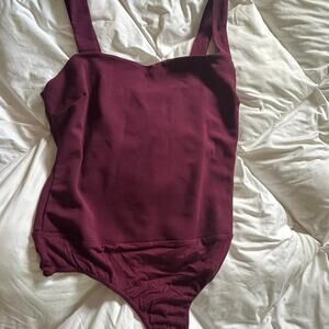 Burgundy bodysuit fits true to